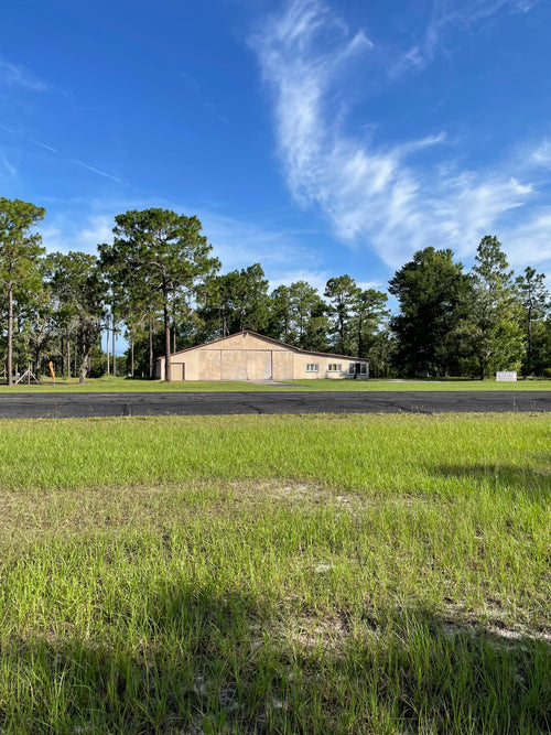 HANGAR & APARTMENT ON PRIVATE RUNWAY 5 ACRES OF PRISTINE WOODLAND