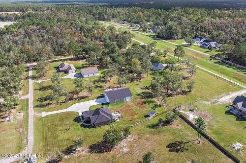 CUSTOM HOME WITH HANGAR AT CUYLER FLD